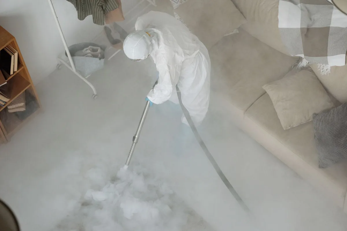 Biohazard cleanup technician in protective equipment, Hubbell-Puritan, Detroit, MI